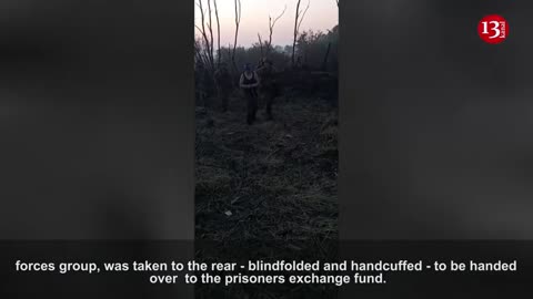 Ukrainian soldiers remove the captured Russian from the battle zone like this