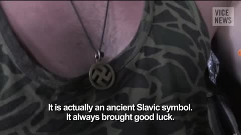 Ukraine escalating to the war. A Ukraine soldier wearing a swastika