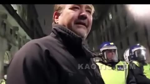 Londoner Arguing With Anonymous At A Protest.