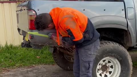 Retrofitting a truck spare tire storage rod.