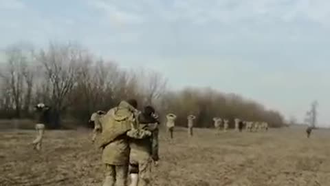 RAF Soldiers Escorts Ukrainian Prisoners Away From The Front