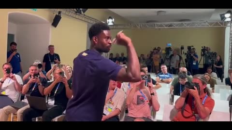 Marc Guehi enjoys a game of darts at England press conference