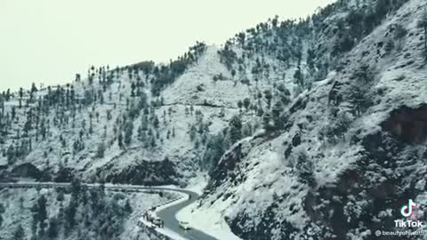 Snow falling out of roadside