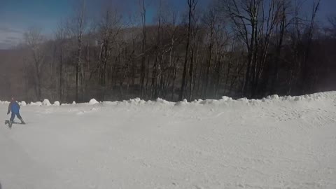 Ski pov kid light blue snow jacket snowboards off trail