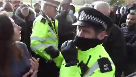 MASKED MEN TRY TO GET A WOMEN REMOVED FROM SPEAKER'S CORNER