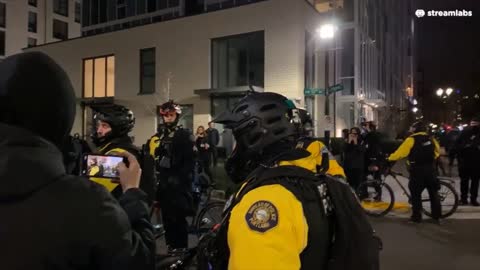 Stop the Sweeps Protest Portland, Protesters vs Bike Cops, Cop can't stop laughing maces protester.