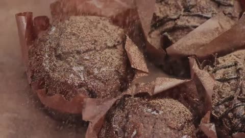 Sprinkle striped chocolate over chocolate cupcakes