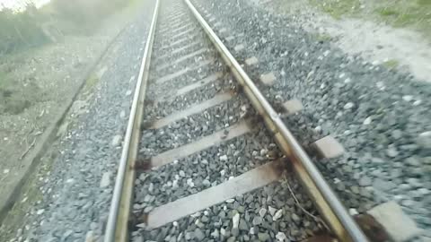 Crazy guy lying on train tracks