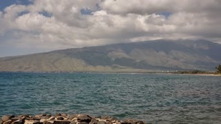 A Sailboat and a Mountain