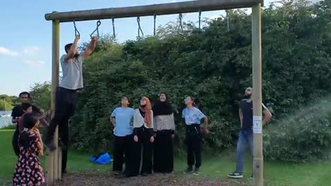 Monkey bars done by old man under core control