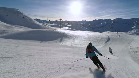 Mountain Skiing On Snow Covered Mountains