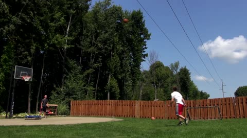 Basketball trick shot combines flip, kick, and a dunk!