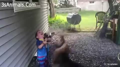 A cute baby boy playing with dog😍