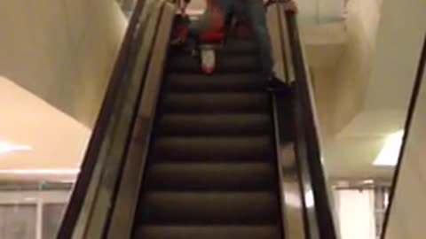 Escalator bike ride falls over handle bars angle 1