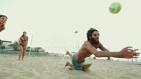 Friends play beach volley and have fun stock video