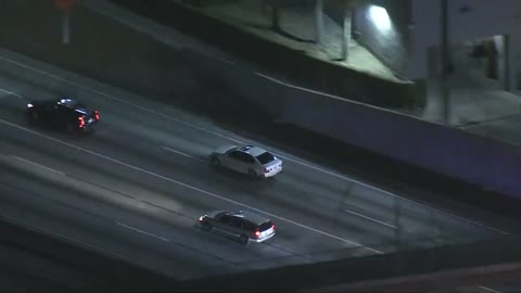 LA County chase_ Suspect's car hood pops off mid-pursuit