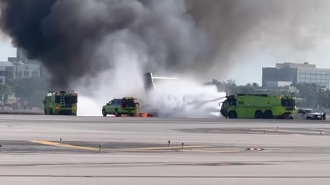 Emergency Crews Work to Extinguish Fire at Airport