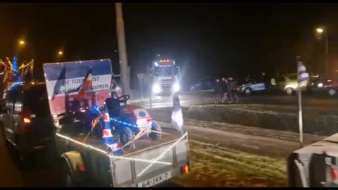 Dutch Farmers and Truckers Convoy Decked Out in Christmas Lights and Upside Down Dutch Flags