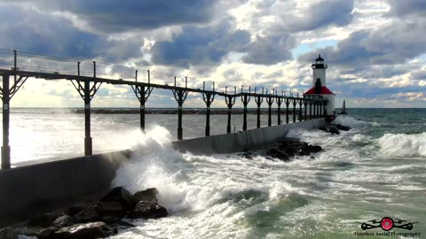 Relaxing Waves Washing Over The Lighthouse Pier 4K Drone Footage