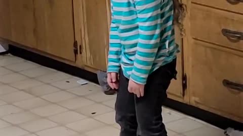 Tired Three-Year-Old Falls Asleep Standing Up