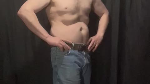 Fat man flexes his flab 1 of 14