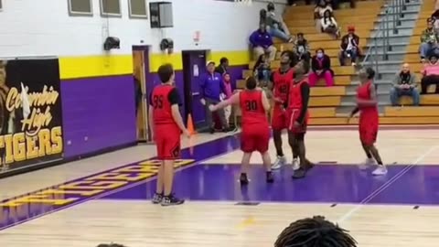 Teammates help their special captain score the winning basket. Very Touching!