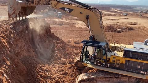 Caterpillar 365C Excavator Loading Trucks