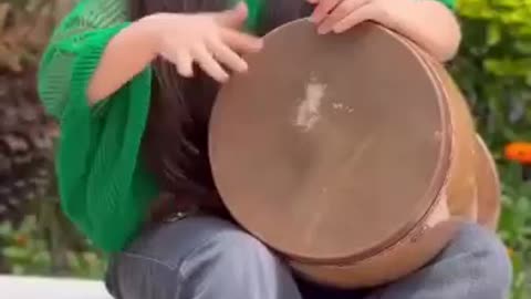 Cute Iranian (Persian) girl playing music