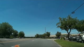 Out of Control Car Reverses Into Car Park