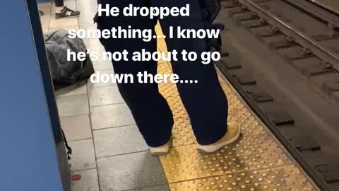 Pt. 2 man hops down to subway train tracks and picks up dropped item, climbs back up