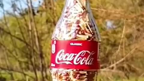 Fire work on coca cola bottle