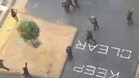 Aerial View Of Riot Police Shooting Rubber Bullets At Construction Workers In Melbourne