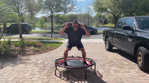 Exercise Technique #3 Trampoline: Sandbag plyometric hops.