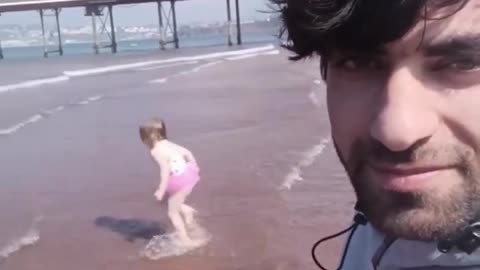 Illegal in UK filming someone’s child playing in the sea with the caption ‘cute