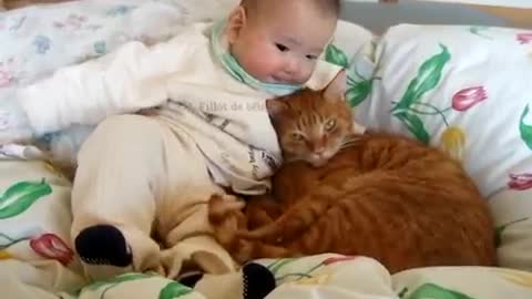 IT'S VERY CUTE!. Baby and kitten sleeping together.