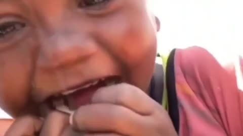 A child sees himself for the first time on a camera