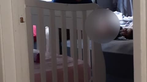 Dad Struggles to Change Baby's Diaper