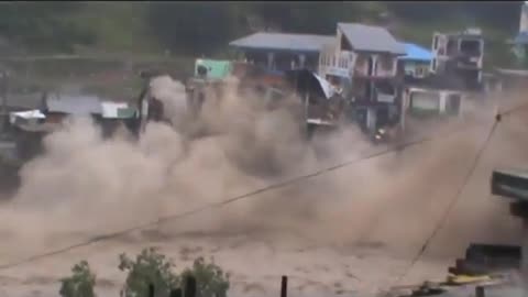 devastating flood destroying hotel building in Pakistan.