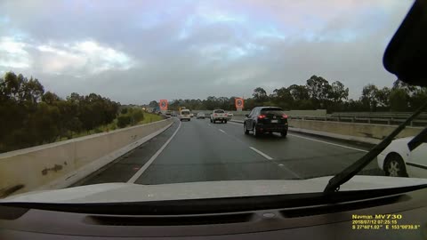 Van Nearly Collides with Road Barrier