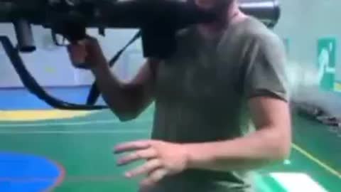 Ukrainian soldier shows off the Carl Gustaf inside a school