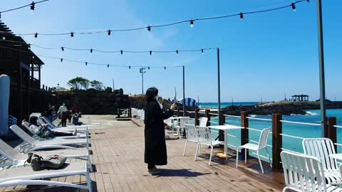 Cafe with emerald sea view