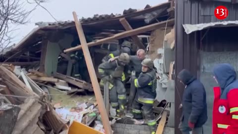 Emergency workers aid injured from damaged building in Zmiiv after Russian missile attack in Ukraine