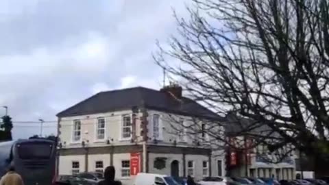 Cheers from the Irish outside of Collumb Barracks in Mullingar as a busload of fighting age...