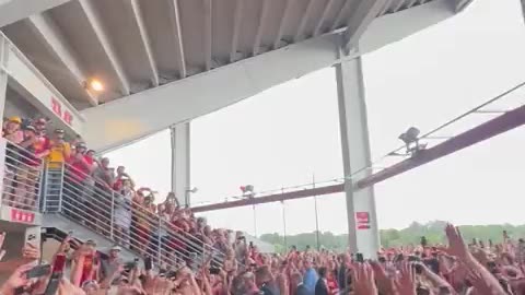 A huge crowd warmly welcomes Trump at an Iowa college football game.