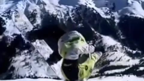 Crazy snowboard jump.