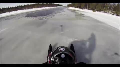 On a snowmobile on the water.