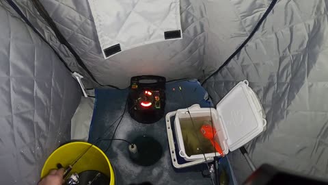 Ice fishing in a rain storm