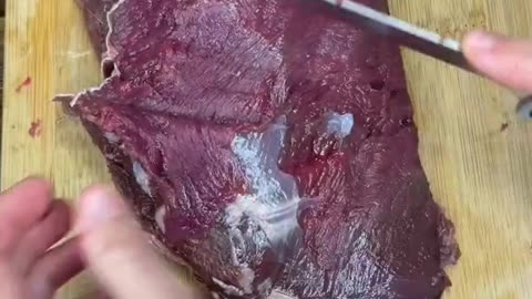 Cleaning up a bottom round roast from a deer