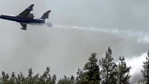 Planes drop water to fight flames in western Turkey