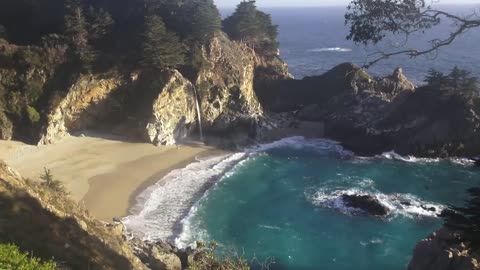 Waterfall on an Ocean Beach at Sunset